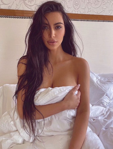 Kim Kardashian bedsheet and long hair 2022